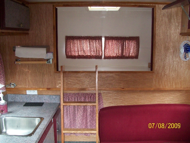 Photo of the kitchen area of the renovated old camper.
