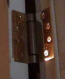 Photo of a door hinge.