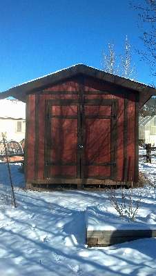 Photo of the completed gable shed surrounded by snow.