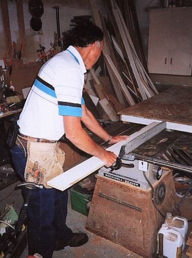 Dave ripping a board on his table saw.