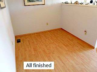 Photo of a finished laminate floor.