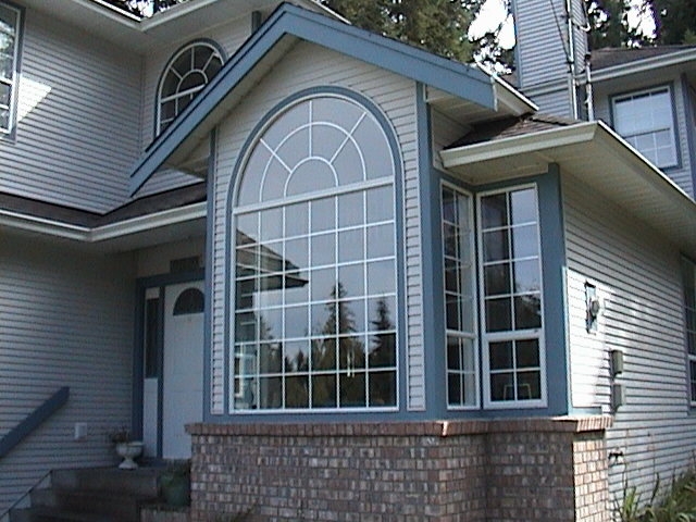 Photo of the front of Daves house showing domed windows.