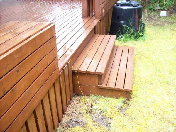 Photo of stairs on a backyard wood deck.