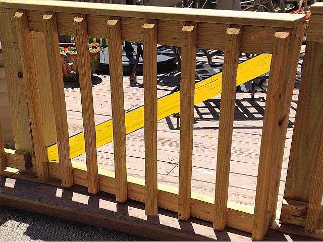 Photo of a deck handrail gate.